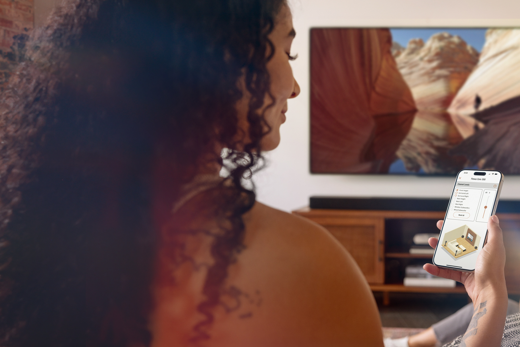 Klipsch Flexus woman using Klipsch Connect Plus app to control her Core 300 2000x1333