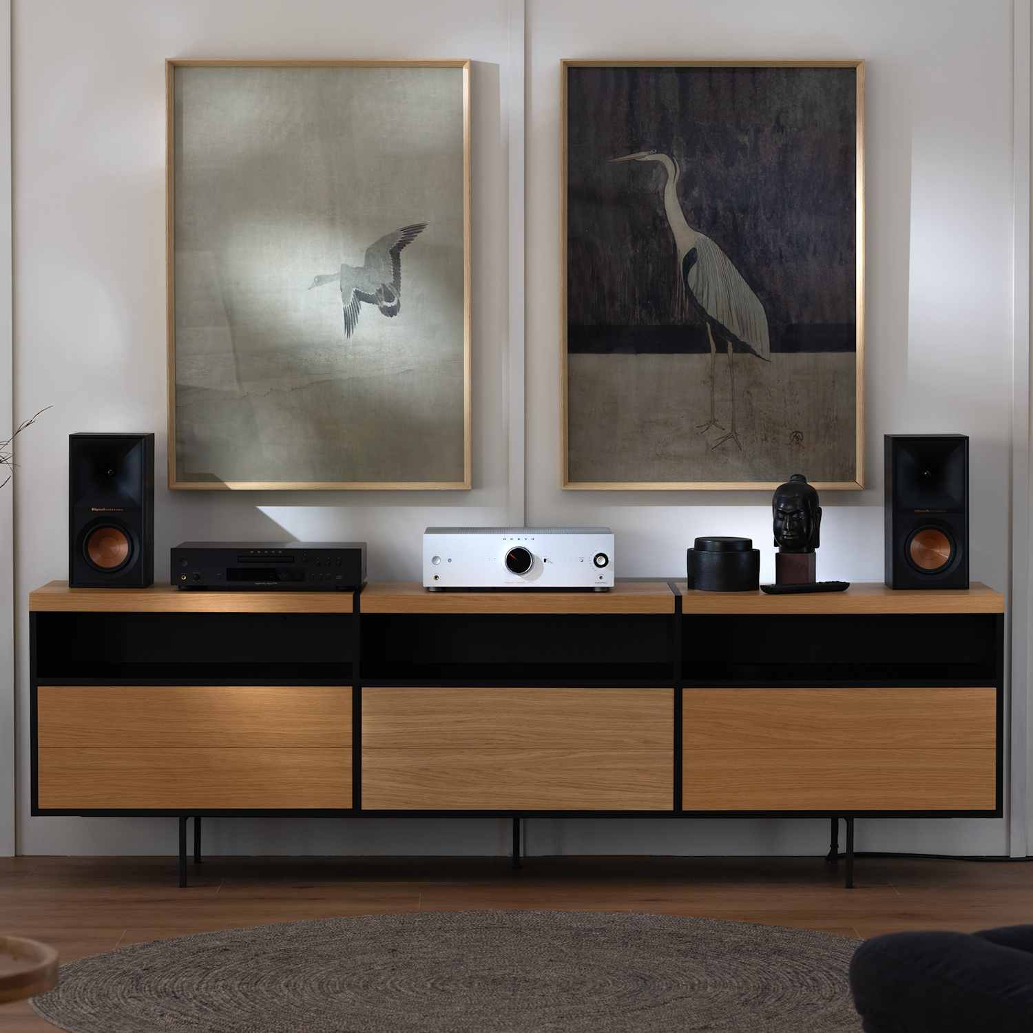 Onkyo Icon A 50 and C 30 Silver and Klipsch bookshelf speakers on media console with crane art on wall behind 2000x2000